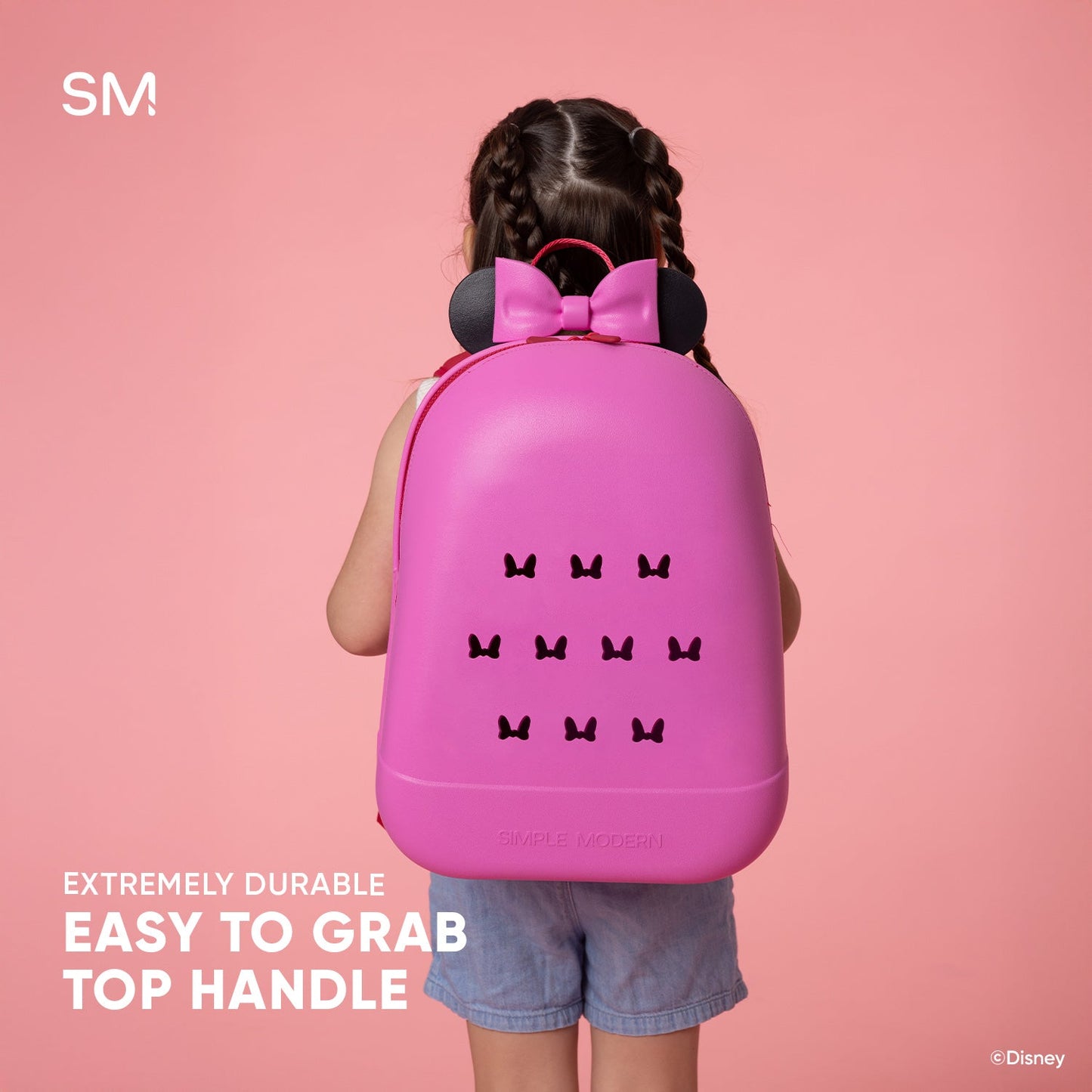 Bright magenta pink Disney kids backpack with easy-to-grab handle against hot pink background, featuring gradient shading for depth and dimension.
