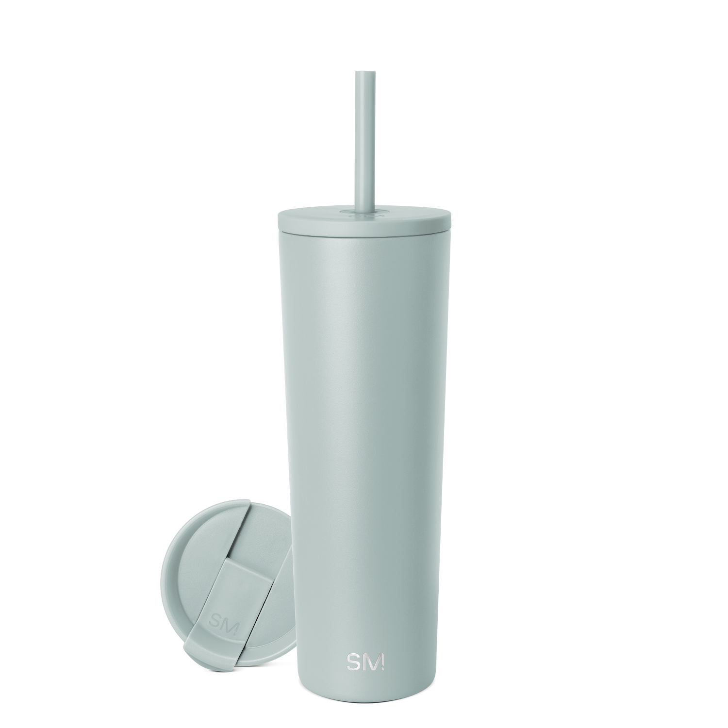 Sage green cylindrical tumbler with matching lid and straw on neutral background