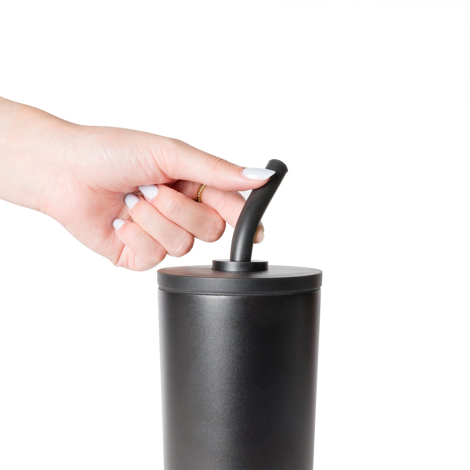 Matte black cylindrical container with matching lid on white background