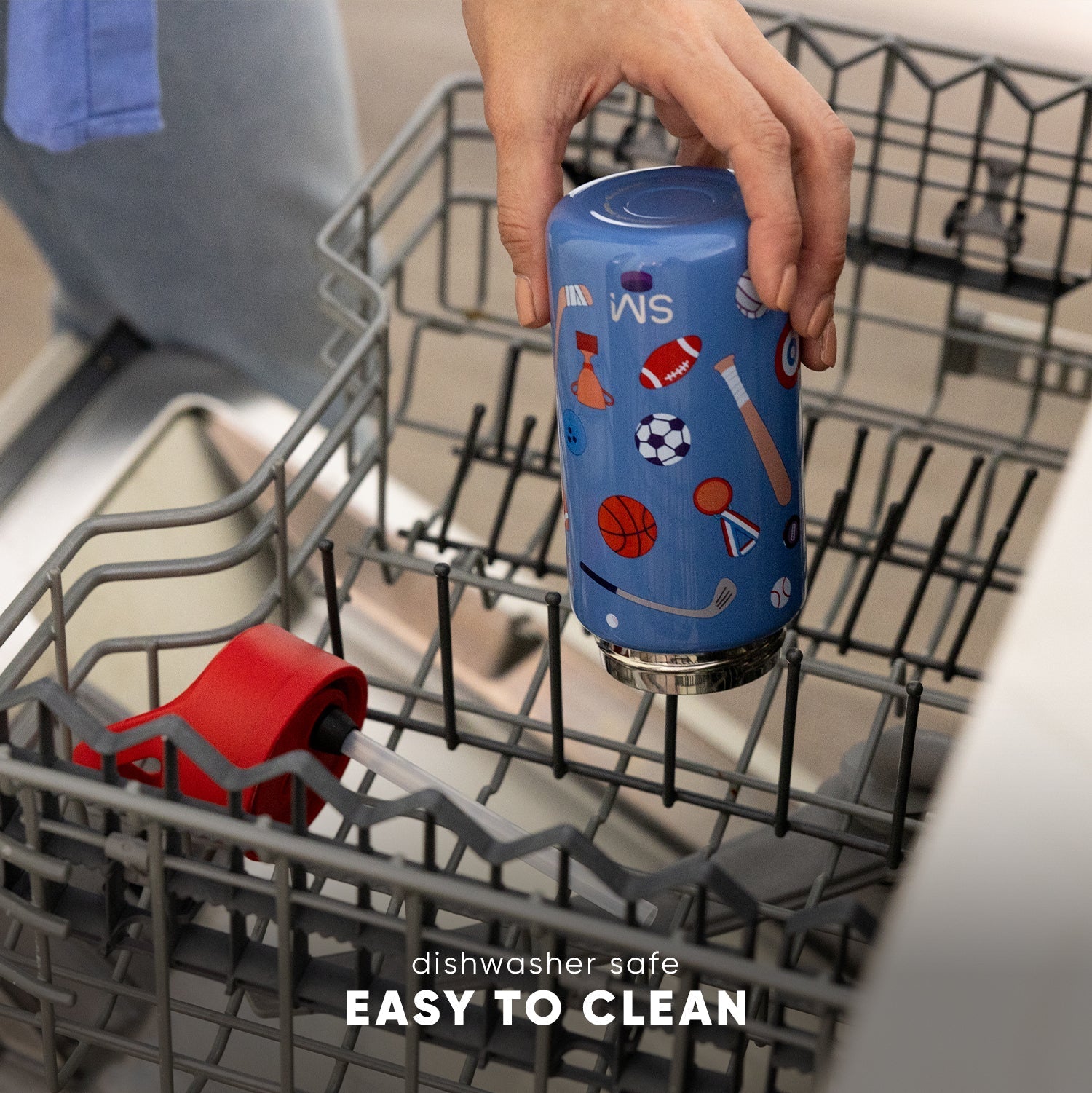 Blue insulated kids' water bottle with sports graphic designs held over an open dishwasher, demonstrating dishwasher-safe feature with "Easy to Clean" text visible.